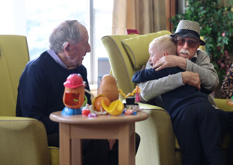 Andy Mahon and John Donohue enjoy their interaction with children.
Photograph: Dara Mac Dónaill







