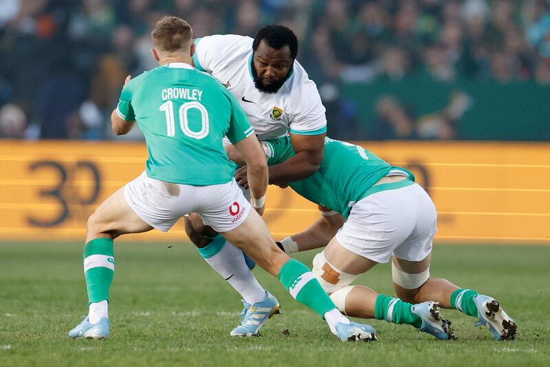 South Africa's prop Ox Nché is tackled by Ireland's Jack Crowley and Josh van der Flier during the first Test in Pretoria. Photograph: Phill Magakoe/AFP via Getty Images