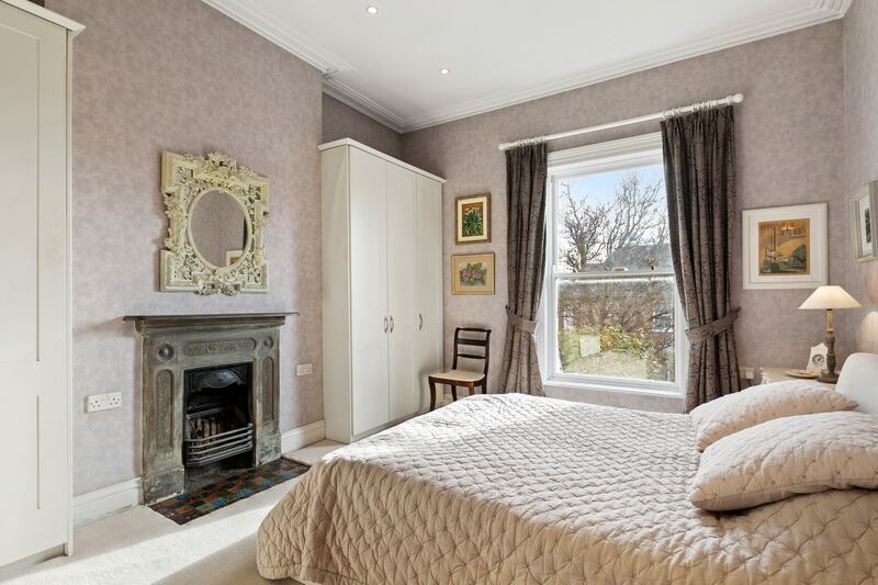 Bedroom with cast-iron fireplace