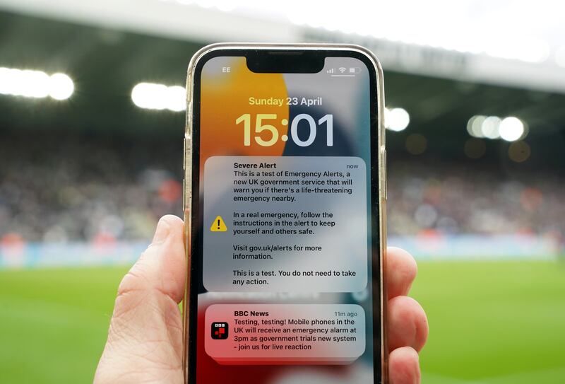 An emergency text alert test on the phone of a fan during the Premier League match. Photograph: Owen Humphreys/PA