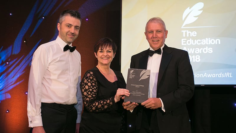 Lynn Willacy, Community and STEM Ambassador, Air Products presents the Career Impact Strategy Award to Damian McGivern & Brian Byers, Ulster University.