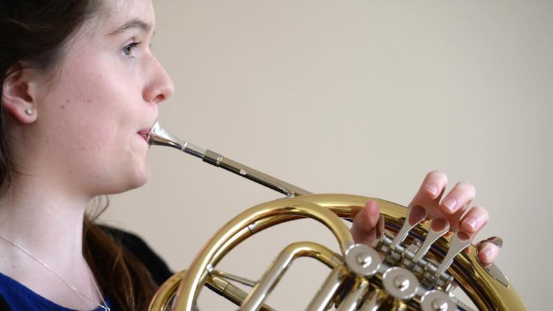 Louise Sullivan, Lauragh, Co Kerry prepares for the senior French horn competition at the ESB Feis Ceoil competition in the RDS Dublin yesterday. Photograph; Dara Mac Dónaill / The Irish Times