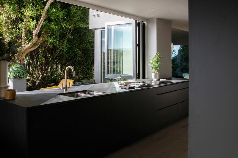 Pic: A bi-fold window opens a small kitchen directly to the garden