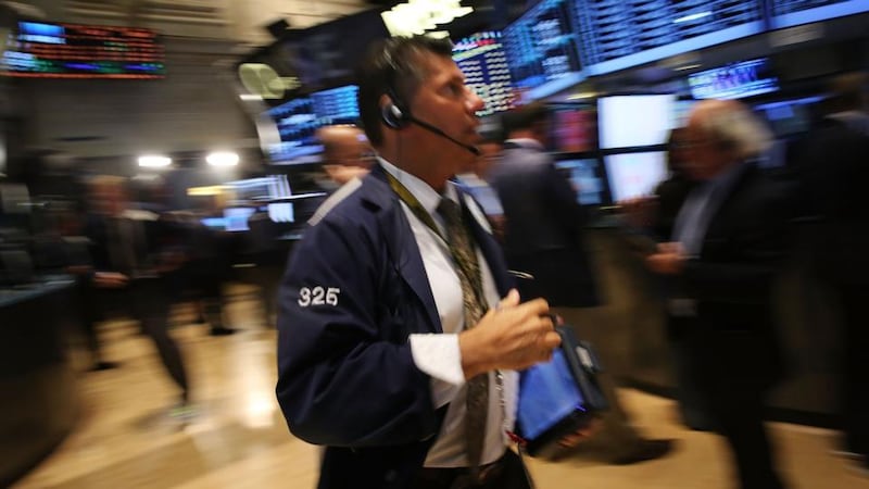 Traders work on the floor of the New York Stock Exchange  in New York City. Photo by Spencer Platt/Getty Images