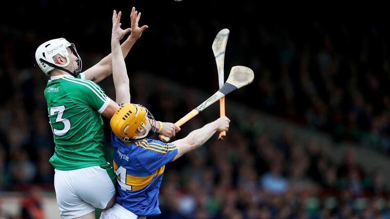 Tipperary’s Donagh Maher challenges in the air with Limerick’s Aaron Gillane. Photograph: Tommy Dickson/Inpho