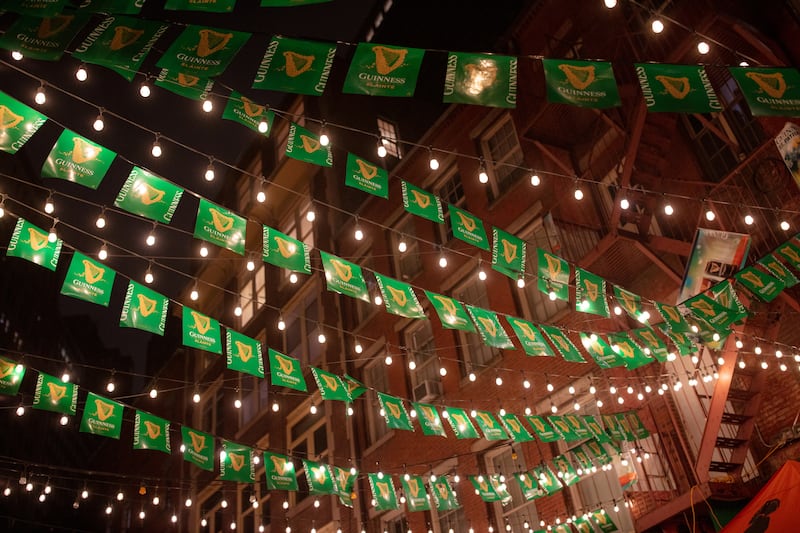 Flags advertising Guinness hang outside Beckett’s Bar and Grill in Manhattan’s Financial District. Photograph: Natalie Keyssar/New York Times
                      