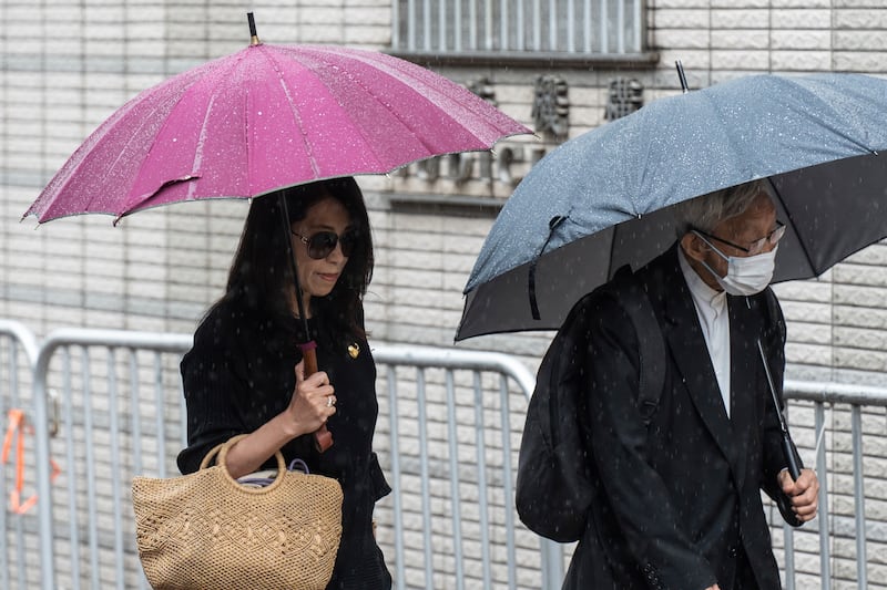 Jimmy Lai’s wife Teresa Lai and retired Chinese cardinal Joseph Zen Ze-Kiun outside the court in Hong Kong on Wednesday. Photograph: Chan Long Hei/AP