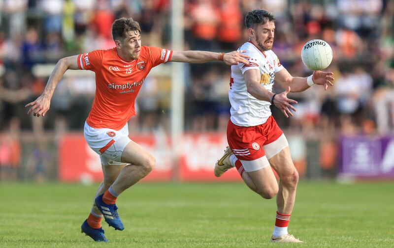 Andrew Murnin chases Tyrone's Matthre Donelly during the All-Ireland SFC clash at Healy Park on Saturday. Photograph: Evan Treacy/Inpho