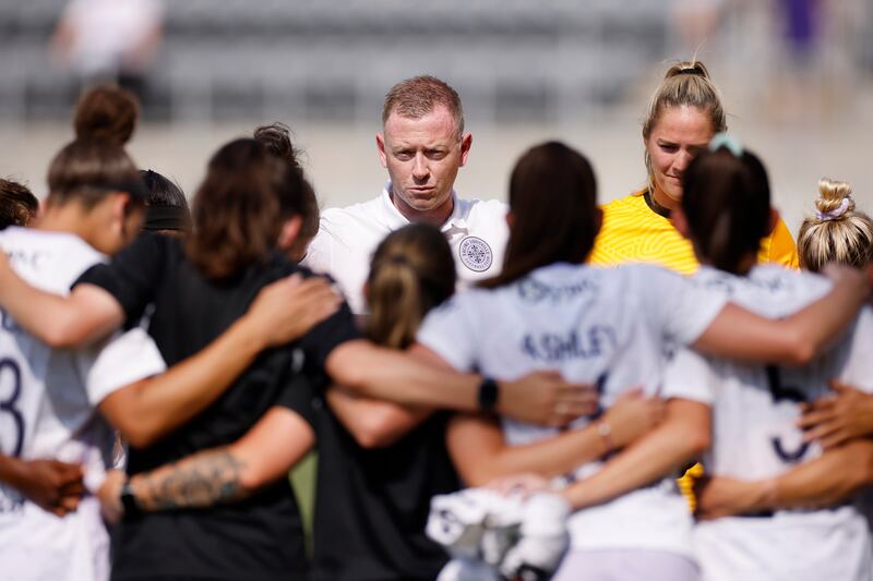 Racing Louisville FC head coach Christy Holly gathers with his players following a win against the Houston Dash at Lynn Family Stadium on June 20th, 2021. Photograph: Joe Robbins/ISI Photos/Getty Images