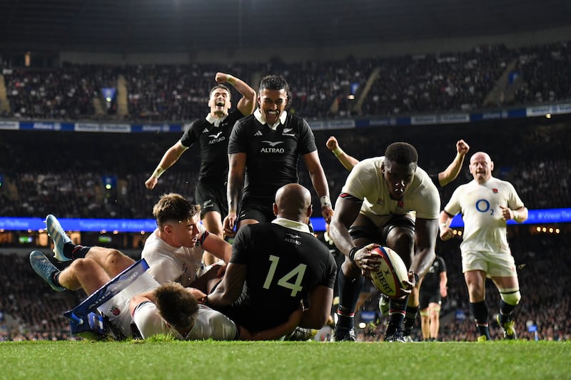 Rieko Ioane and Will Jordan of New Zealand rush to celebrate Mark Tele'a's crucial late try against England at Twickenham. New Zealand won 24-22. Photograph: Mike Hewitt/Getty Images