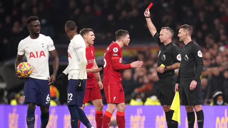 Referee Paul Tierney shows a red card to Liverpool’s Andy Robertson after a VAR review for a foul on Tottenham Hotspur’s Emerson Royal during the Premier League match at the Tottenham Hotspur Stadium. Photograph: Adam Davy/PA Wire