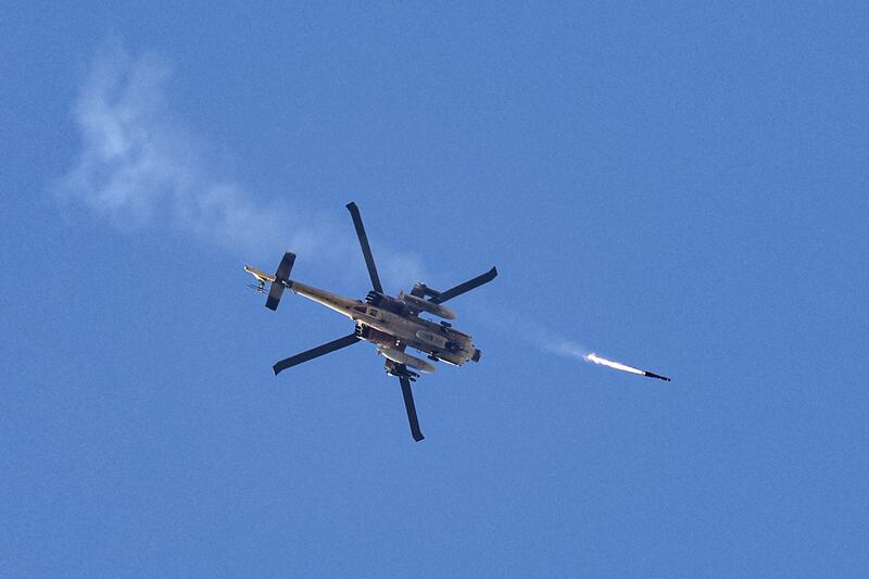 An Israeli air force attack helicopter fires a missile over Gaza. Photograph:  Jack Guez/AFP via Getty Images