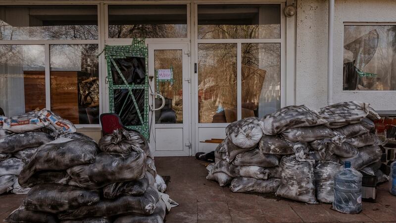 The entrance to 144 Yablunska Street, a notorious Russian base where eight people were executed, in Bucha. Photograph: Daniel Berehulak/The New York Times