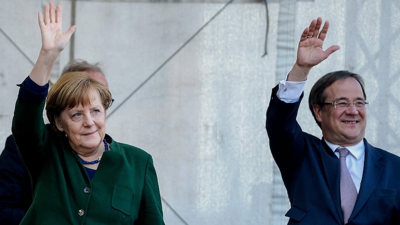 Chancellor and leader of the German Christian Democrats (CDU) Angela Merkel and local  CDU candidate Armin Lachet in Haltern am See, North Rhine-Westphalia. Photograph: Sascha Schuermann/Getty Images