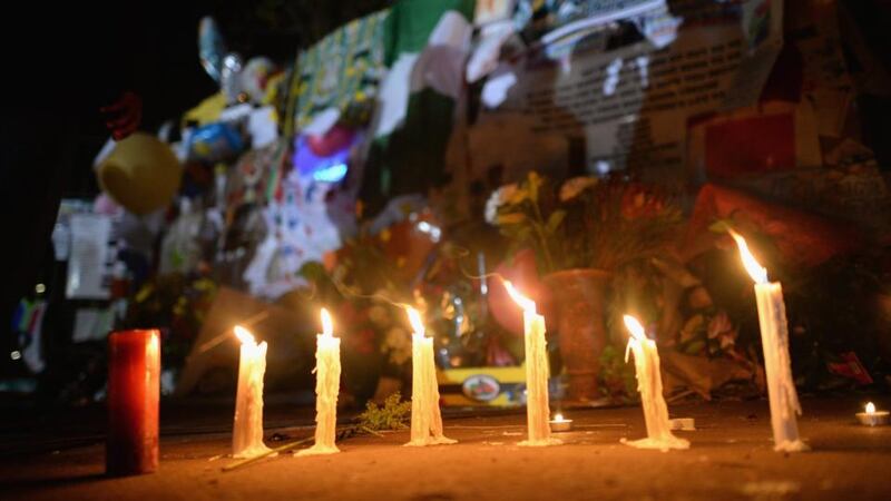 Candles sit on the ground for Nelson Mandela outside the Mediclinic Heart Hospital. Photograph: Jeff J Mitchell/Getty Images