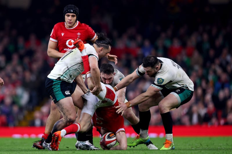 Wales' Gareth Anscombe is tackled by James Lowe, Jack Conan and Robbie Henshaw of Ireland. Photograph: Ben Brady/Inpho