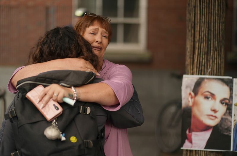 Fans become emotional during the tribute to the singer's life. Photograph: Brian Lawless/PA Wire