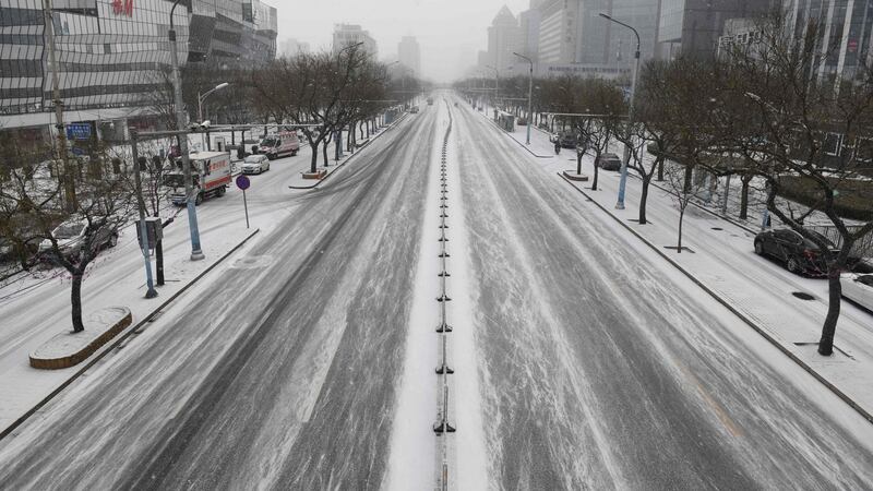 An empty street in Beijing on Wednesday. Photograph: Greg Baker/AFP via Getty Images