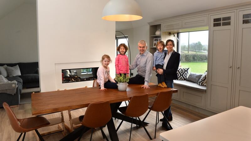 Inge and Declan Ronaghan, in their new home with children Lexie, Sienna and Matthew in Coolmuckbane, Co Monaghan. Photograph: Dara Mac Dónaill