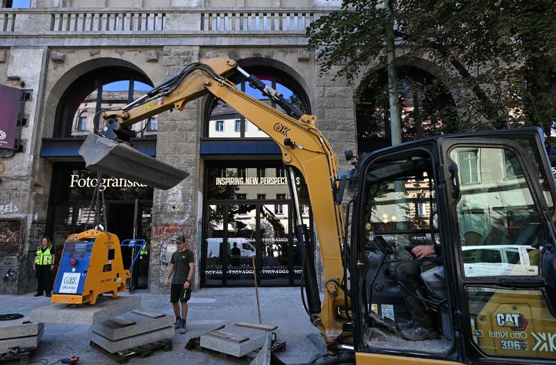 Workers add finishing touches in front of the Fotografiska photography museum in Berlin on September 7h, 2023. Photograph: John Macdougall/AFP via Getty Images