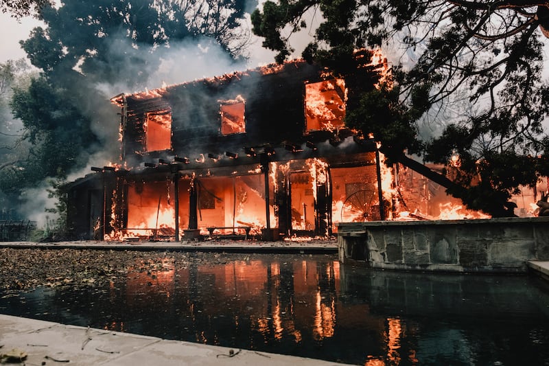 A house burns during the Palisades Fire. Photograph: Mark Abramson/The New York Times
                      