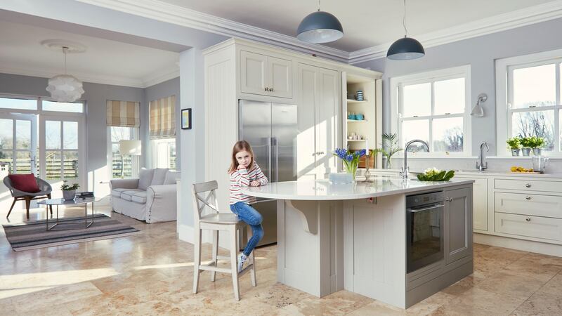 Éabha in the open plan kitchen area with views into the living room. Photograph: Philip Lauterbach