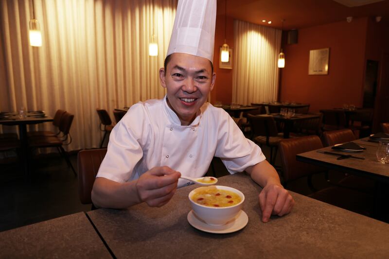 Chef Ran Qiwan of Nan restaurant with his pumpkin sweet wine soup and rice balls. Photograph: Bryan O’Brien