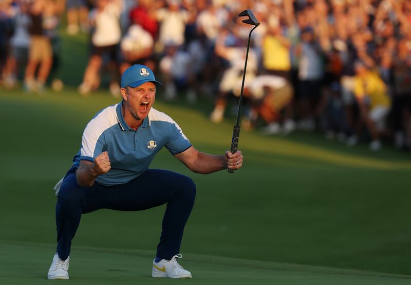 Justin Rose of Team Europe celebrates on the 18th green during the Friday afternoon fourball matches. Photograph: Patrick Smith/Getty