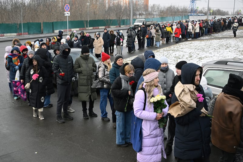 People queue to pay tribute to late Russian opposition leader Alexei Navalny at his grave at the Borisovo cemetery, Moscow. Photo by Alexander Nemenov/AFP/via Getty Images  