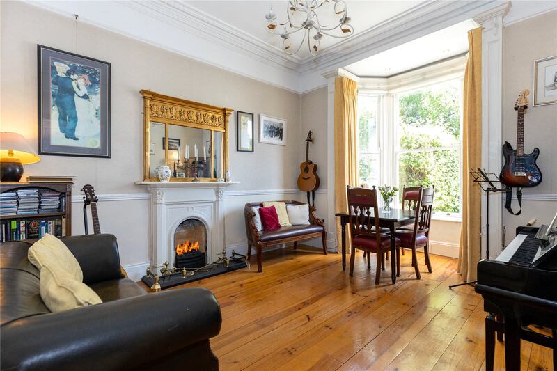 The diningroom is lit by Velux windows and a utility room with a door opening on to a side passage beside the house