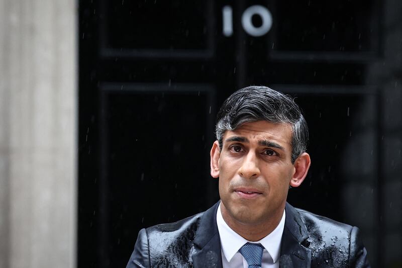 Wet weather has not been UK prime minister Rishi Sunak’s friend of late. Photograph: Henry Nicholls/AFP via Getty