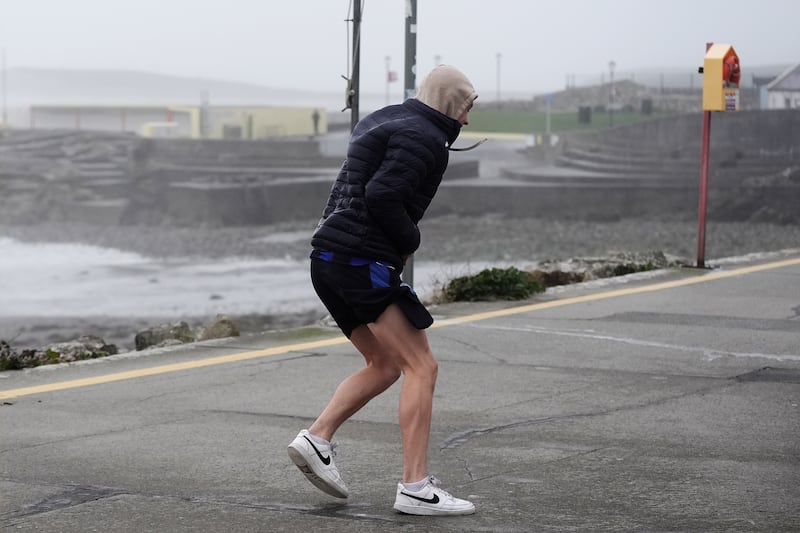 People struggle to walk in the wind on the promenade in Salthill. Photograph: Brian Lawless/PA Wire