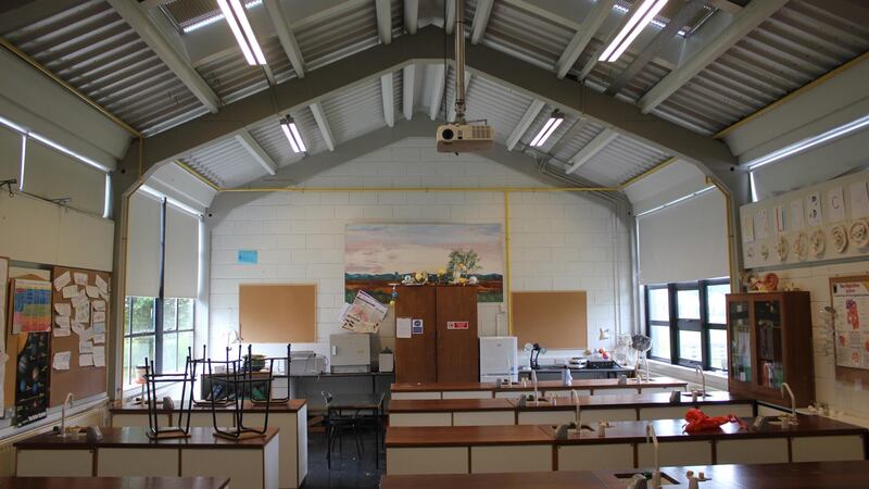 St Brendan’s Community School: its steel-framed structures have corrugated roofing, with breeze block and brick gable ends.