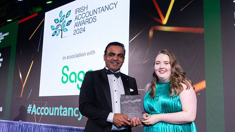 Irfan Hameed, chief executive, Intax, presents the part-qualified accountant of the year award to Aoife Ormond, Fitzgerald Power