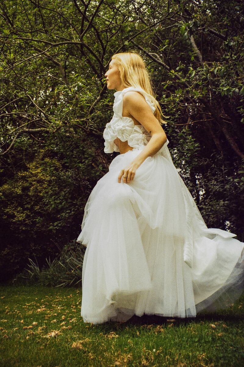 White tulle ballerina skirt (€600) and white taffeta daisy vest (€400), both made to order