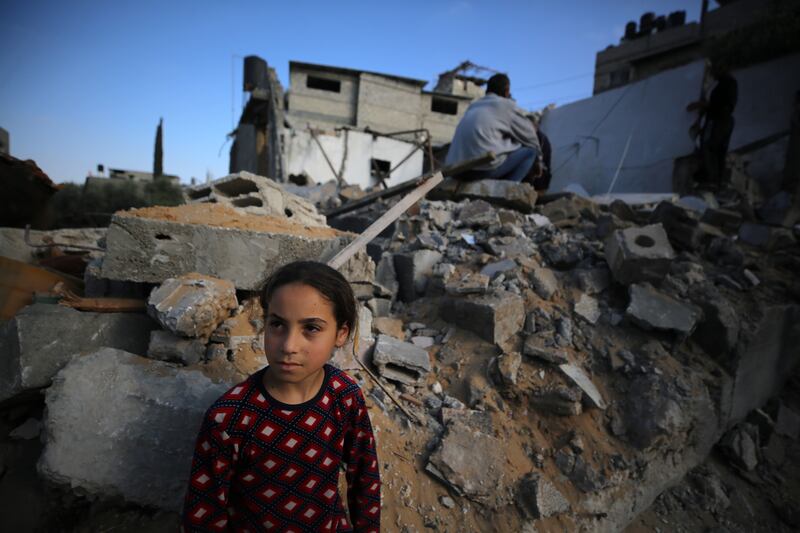 People gather around the rubble of a building destroyed in an Israeli air strike in Beit Lahia in the northern Gaza Strip on Saturday. Photograph:  Majdi Fathi/NurPhoto via Getty Images