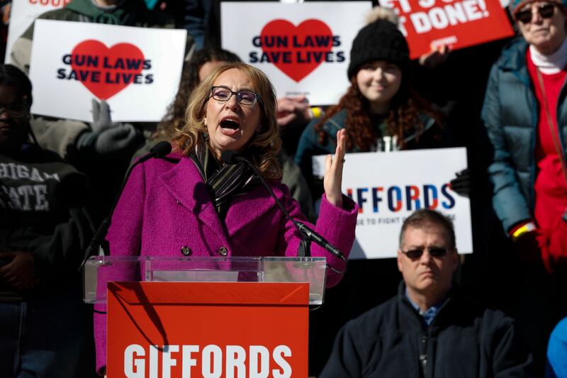 Former Democratic congresswoman Gabby  Giffords, who survived being shot during a 2011 mass shooting, speaks to a large crowd to demand action on gun safety at the Michigan State Capitol on March 15th, 2023 in Lansing, one month after three students were killed and five injured in a mass shooting at Michigan State University. Photograph:  by Chris du Mond/Getty Images