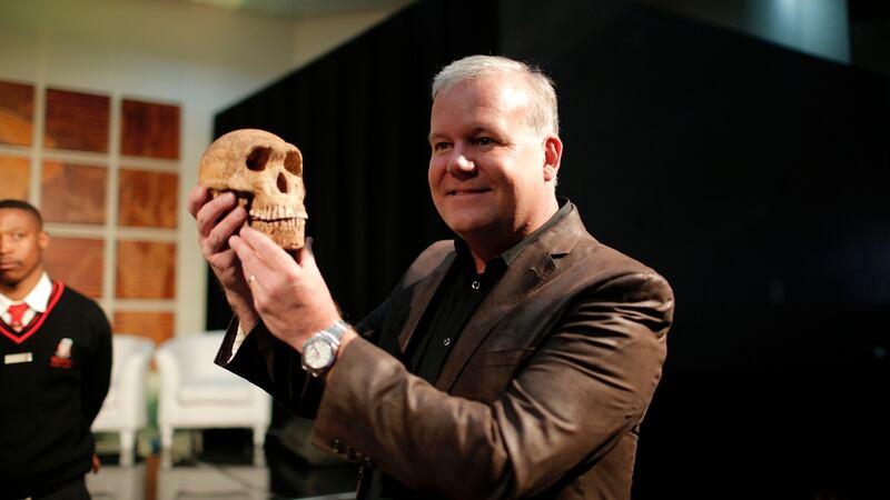 Prof Lee Berger with a replica of Homo Naledi Hominin species at the cradle of Human Kind. Photograph: Getty Images