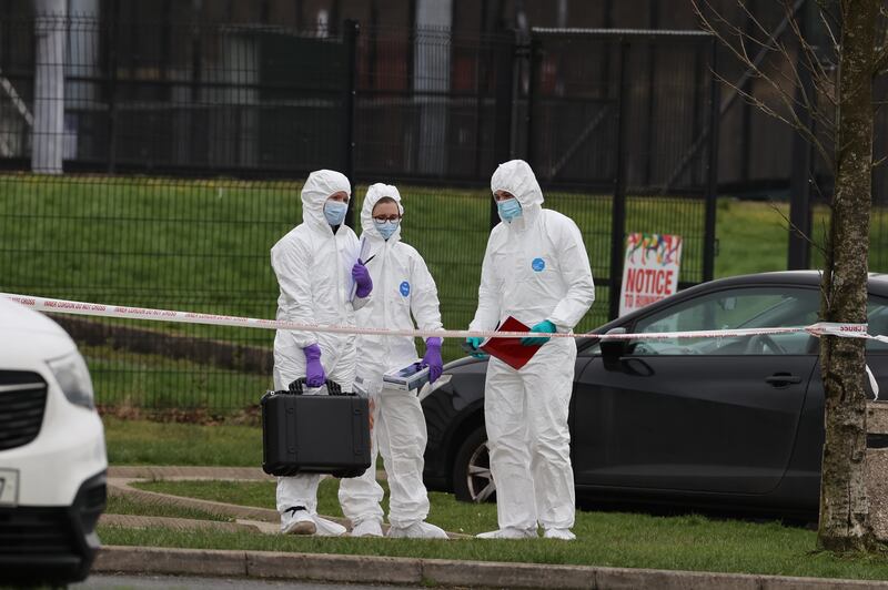 Forensic officers from Police Service of Northern Ireland (PSNI) at the sports complex in the Killyclogher Road area of Omagh where the shooting took place. Photograph: Liam McBurney/PA