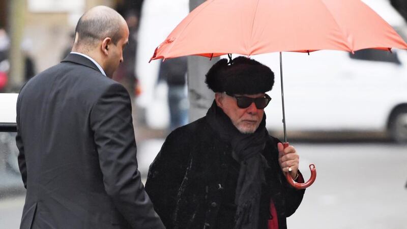 Former rockstar Gary Glitter (R), real name Paul Gadd, arrives at Southwark Crown Court in Central London. He has been found guilty of  charges relating to historic sex offenses against two young girls. Photograph: Facudno Arrizabalaga/EPA.