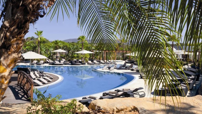 The luxurious pool area at the five-star Conrad Algarve hotel