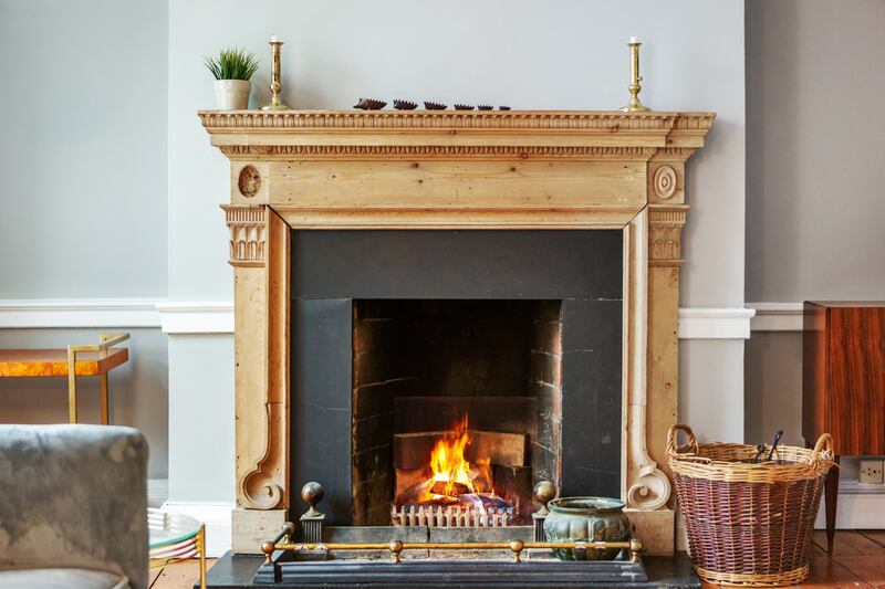 The property retains some lovely period details including this fireplace.