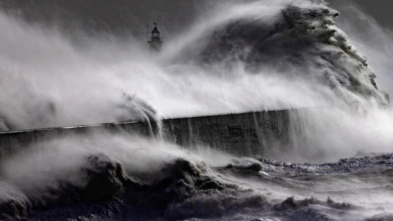 Storm waves battered the Newhaven breakwater and lighthouse as Storm Eunice made landfall. It was the worst storm to hit the UK for three decades. Photograph:  Dan Kitwood/Getty