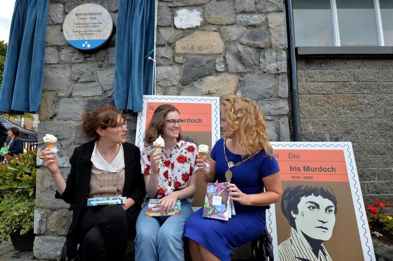 The Iris Murdoch plaque at Blessington Street Park, adjacent to her home, pictured at its unveiling in July 2019 when a stamp was also released in her honour, with philosopher Clare Mac Cumhaill; Rosanna Turner, a finalist in the Irish Young Philosopher Awards; and Cllr Mary Fitzpatrick. Photograph: Alan Betson/The Irish Times