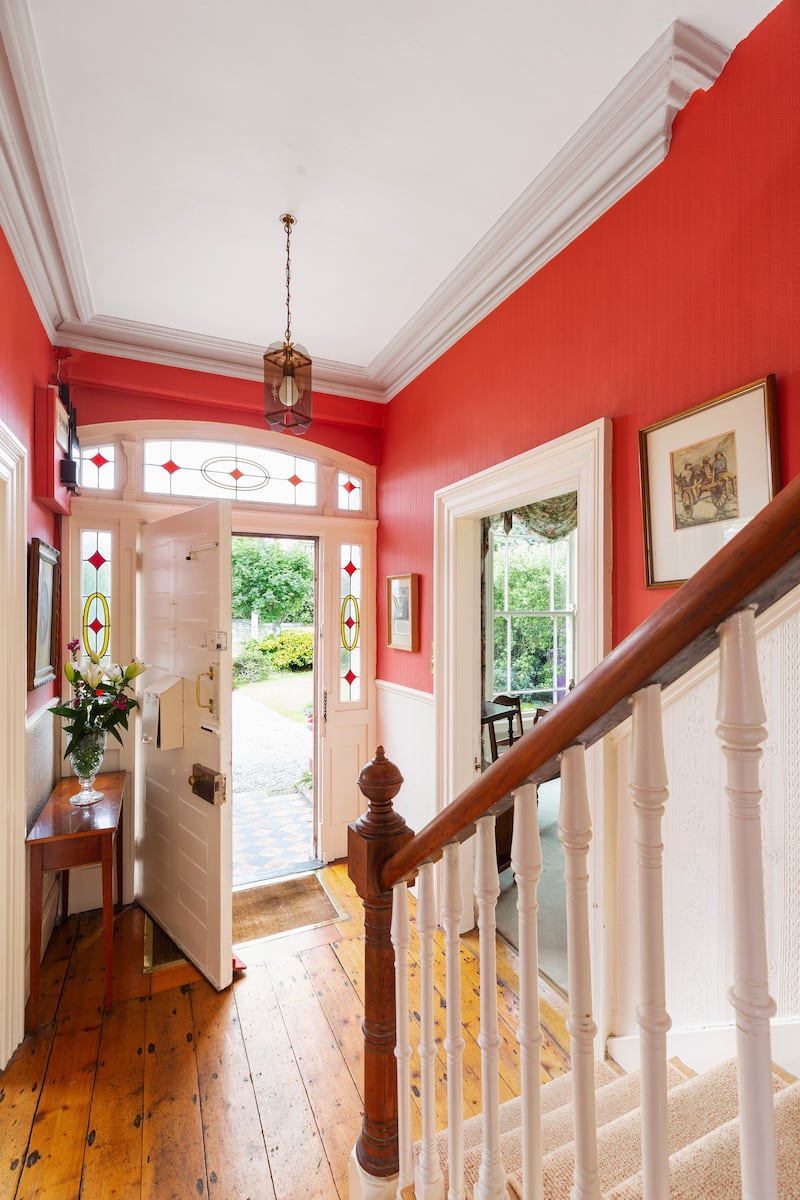 Two formal reception rooms flank each side of the front hall of the property.