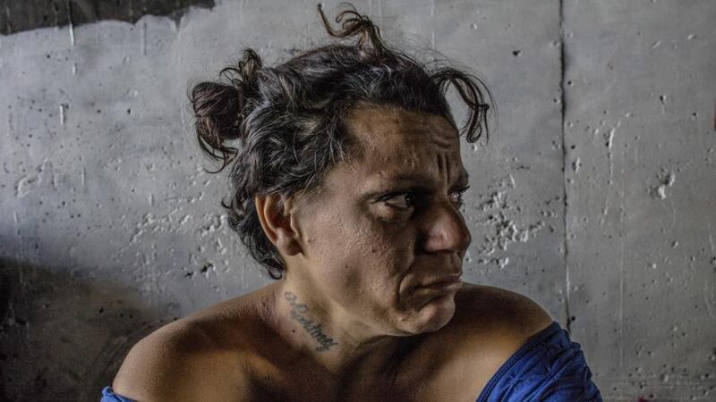 Desiree Miranda, also known as “Boxer,” who was deported two years ago from California after a problem with law enforcement, in a tunnel where she lives in Tijuana, Mexico. “El Bordo” is a catch basin for the drug addicted and the deported, sometimes both, near the US-Mexico border. Photograph: Adriana Zehbrauskas/The New York Times