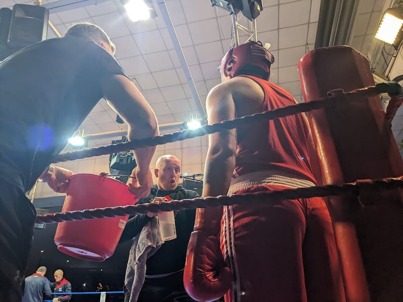 Judy Bobbett receives instruction from her coach, Trevor McMahon.