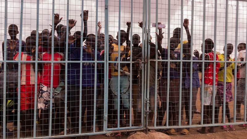 Children wait outside a small library in Kakuma refugee camp, where adequate study spaces are in short supply. Photograph: Ruairi Casey