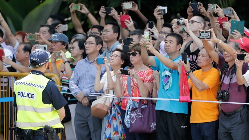 Singaporeans gather in front of the Istana Presidential Palace, Singapore, where US President Donald J Trump and Singapore prime minister Lee Hsien Loong will meet. Photograph: Mast Irham/EPA