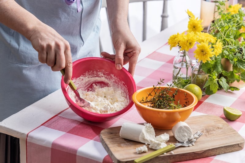 Preparing a simple goats cheese and thyme filling for a savoury topping for the spelt scones. You can drizzle this with a little honey to add some sweetness